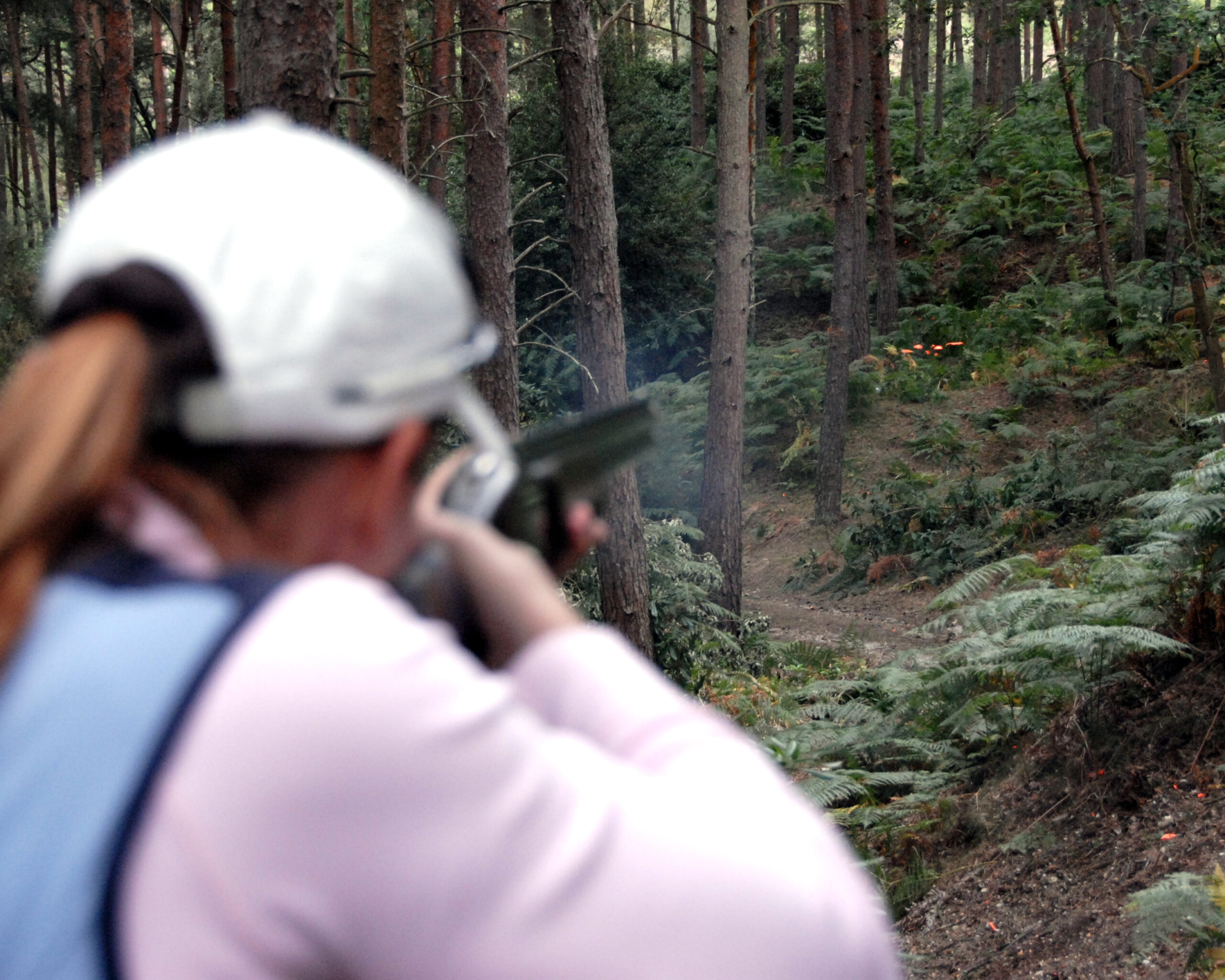 woman with a shotgun in forest | shotgun and firearms applications and renewals medical reports | Shotgun Medicals